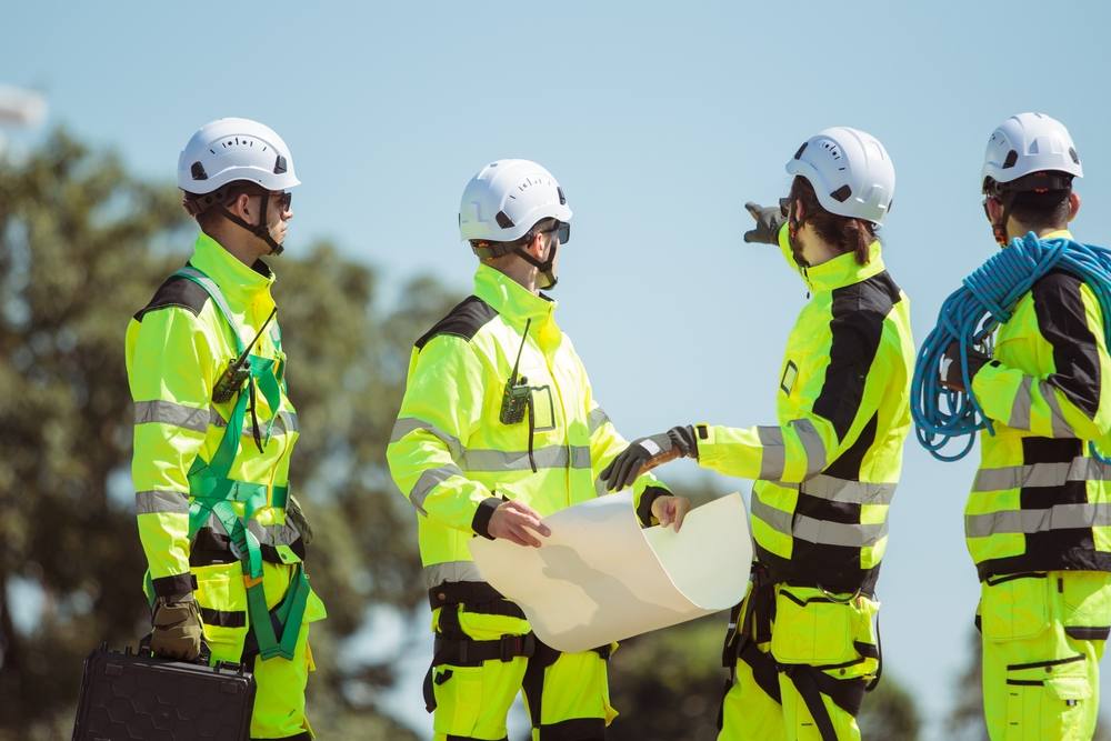 Engineers reviewing plans on site